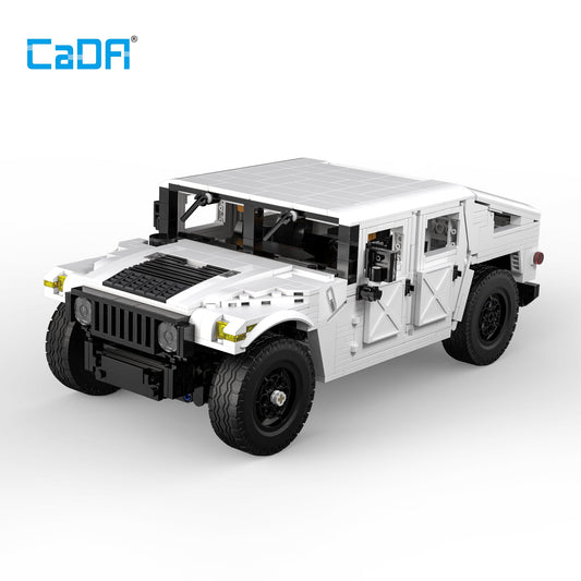 CaDA white and black buildable Humvee SUV model with opening doors, solar panel roof, black tires, and detailed interior components on plain background