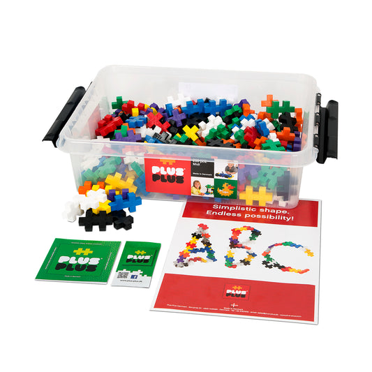 Plus-Plus BIG building blocks set with 200 colorful plastic pieces in clear storage tub, instruction cards, and example project designs showing letters and shap