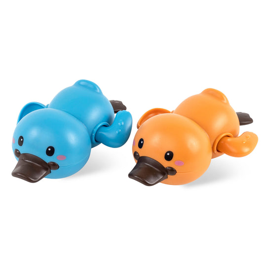 Two wind-up bath toy platypuses, one blue and one orange, with black beaks and flippers on a white background