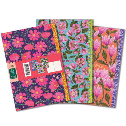 Piece & Love Little Books Set featuring three colorful floral notebooks with pink flowers on navy, turquoise, and ora...