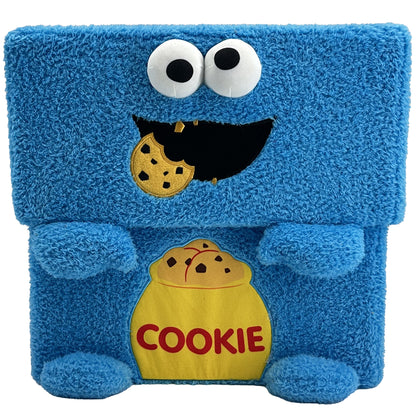 Blue plush cube storage bin featuring Cookie Monster character with large googly eyes, open mouth, and cookie design on front pocket
