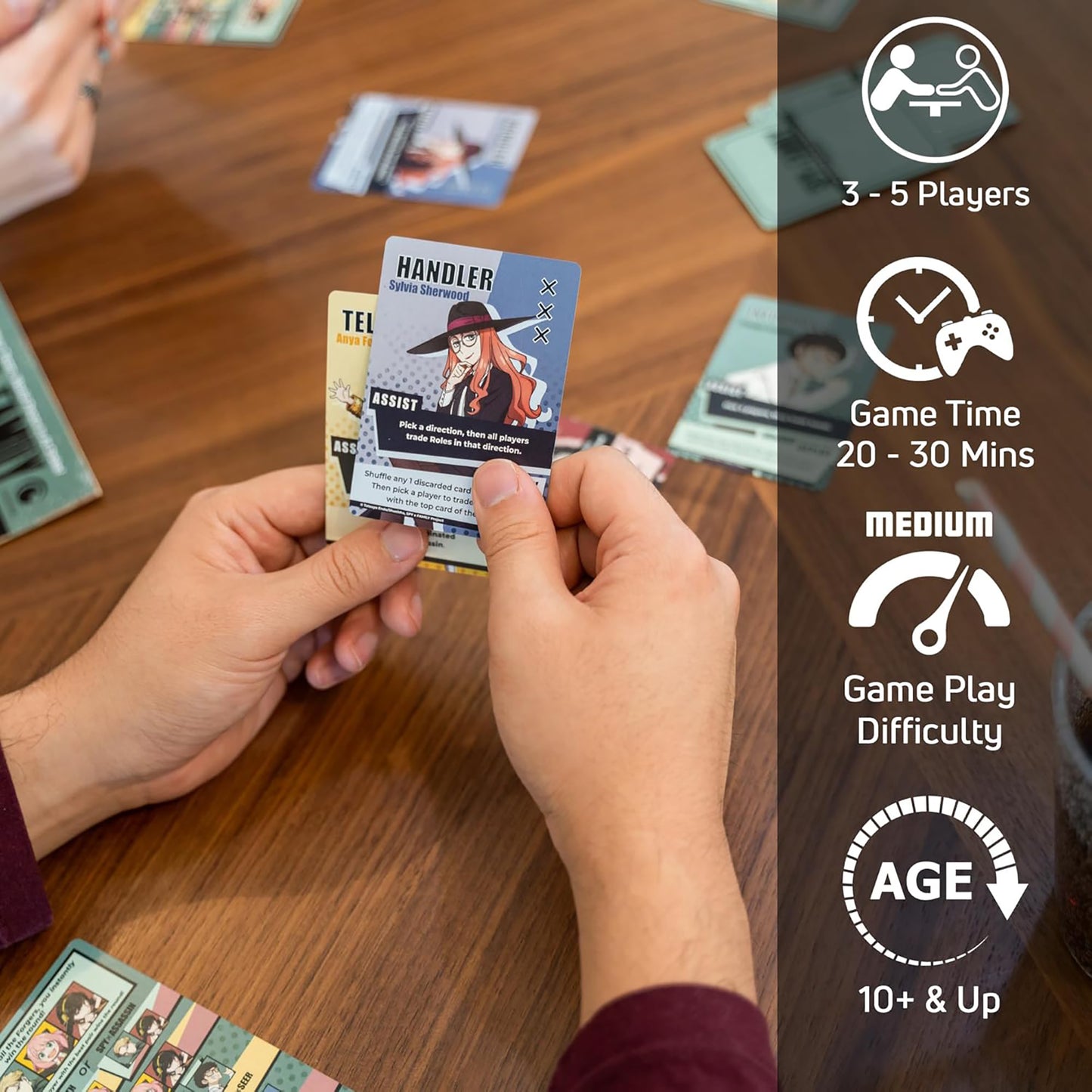 KESS Spy x Family Mission for Peanuts deduction card game being played by hands over wooden table