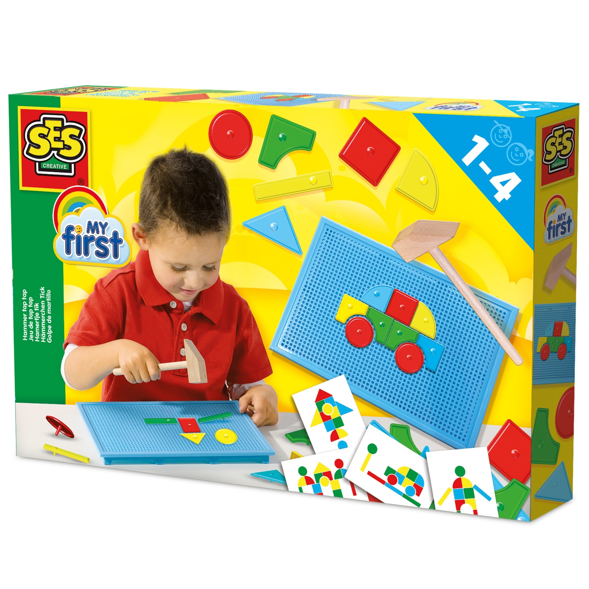 Modeled by a child in red shirt using SES Creative My First Hammer Tap Tap toy with blue pegboard, colorful shapes, wooden hammer, and instruction cards showing