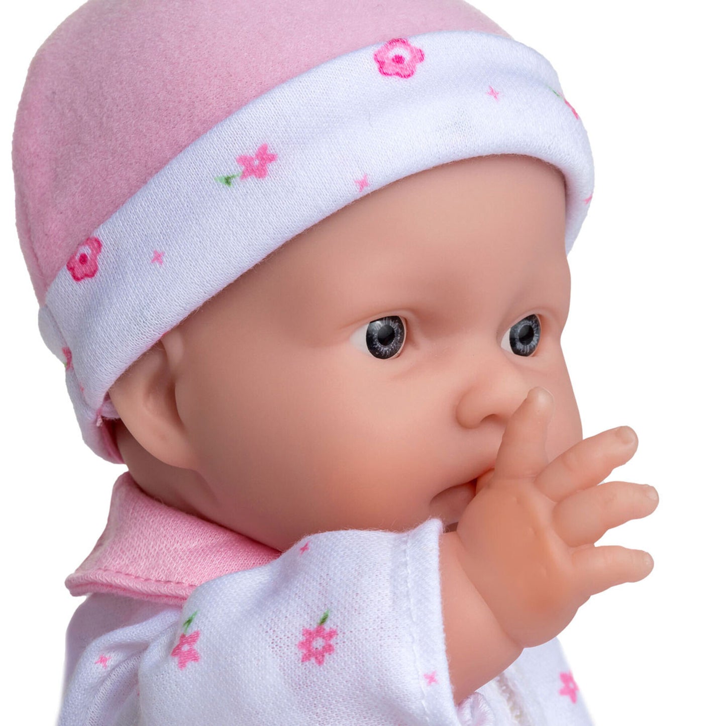 JC Toys La Baby 11 inch soft body doll wearing pink outfit and white floral headband
