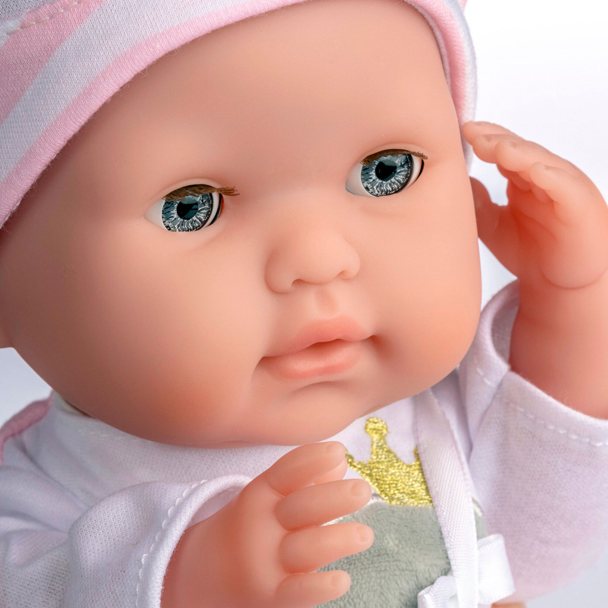 JC Toys Nonis Boutique 15" baby doll with blue eyes, pink hat, soft body, and accessories