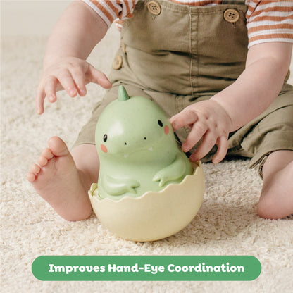 Tiger Tribe Roly Poly Dino green eco toy with baby hands, develops motor skills