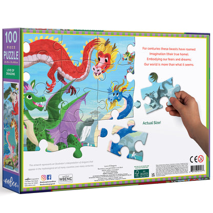 Love of Dragons 100 Piece Puzzle featuring colorful red, green, and blue dragons in a whimsical sky scene