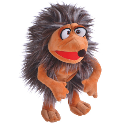 Orange and brown plush hand puppet with spiky dark hair, large expressive eyes, and red mouth, designed as a hedgehog character