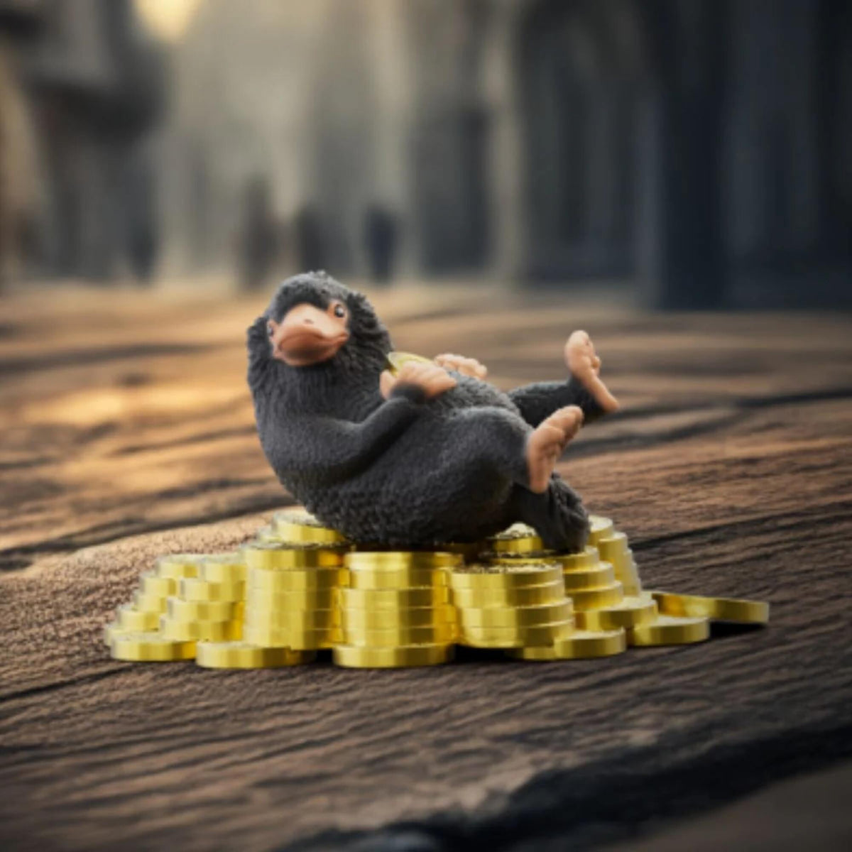 Wizarding World Niffler & Gold toy figure with black plush niffler on gold coins