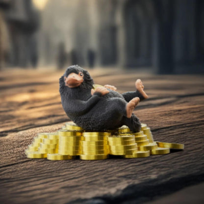 Wizarding World Niffler & Gold toy figure with black plush niffler on gold coins