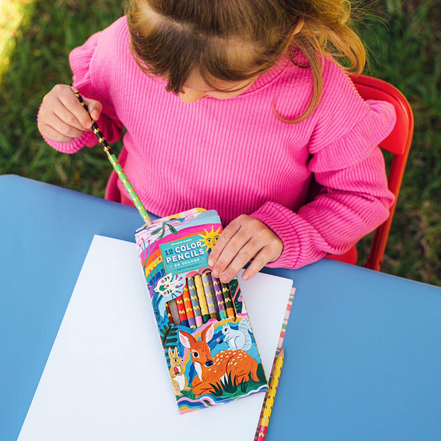 eeBoo 12-piece colored pencils set with vibrant metallic shades in silver barrels, displayed by child in pink shirt