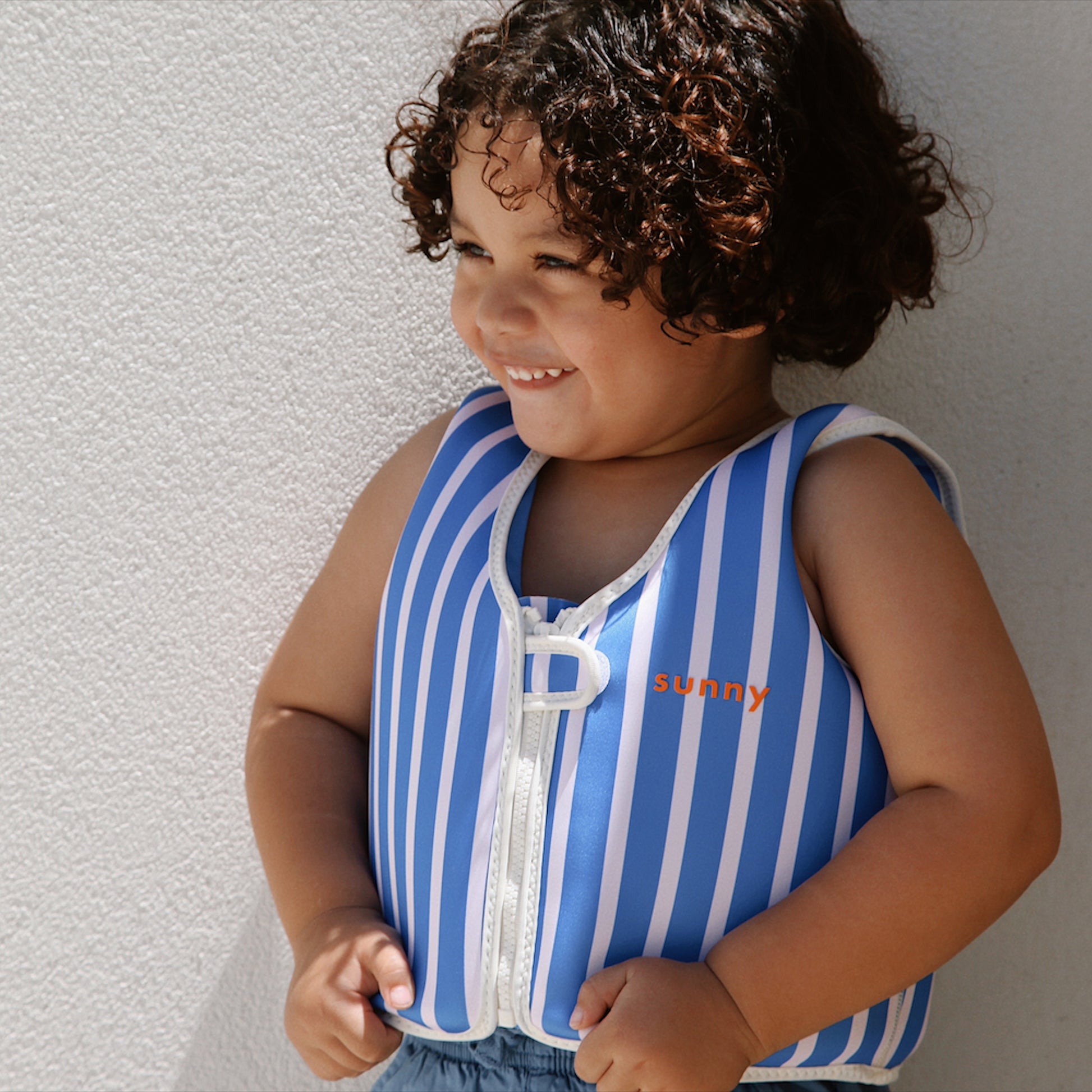 Blue striped Float Vest for toddlers, size 3-6, with white stripes and front zipper