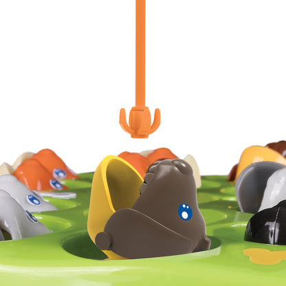 The Fishing Game: Dog Edition with brown dog and orange claw toy