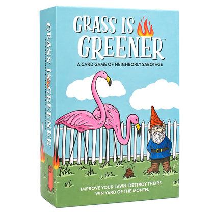Grass Is Greener card game box featuring pink flamingos and a garden gnome with white picket fence, blue sky background