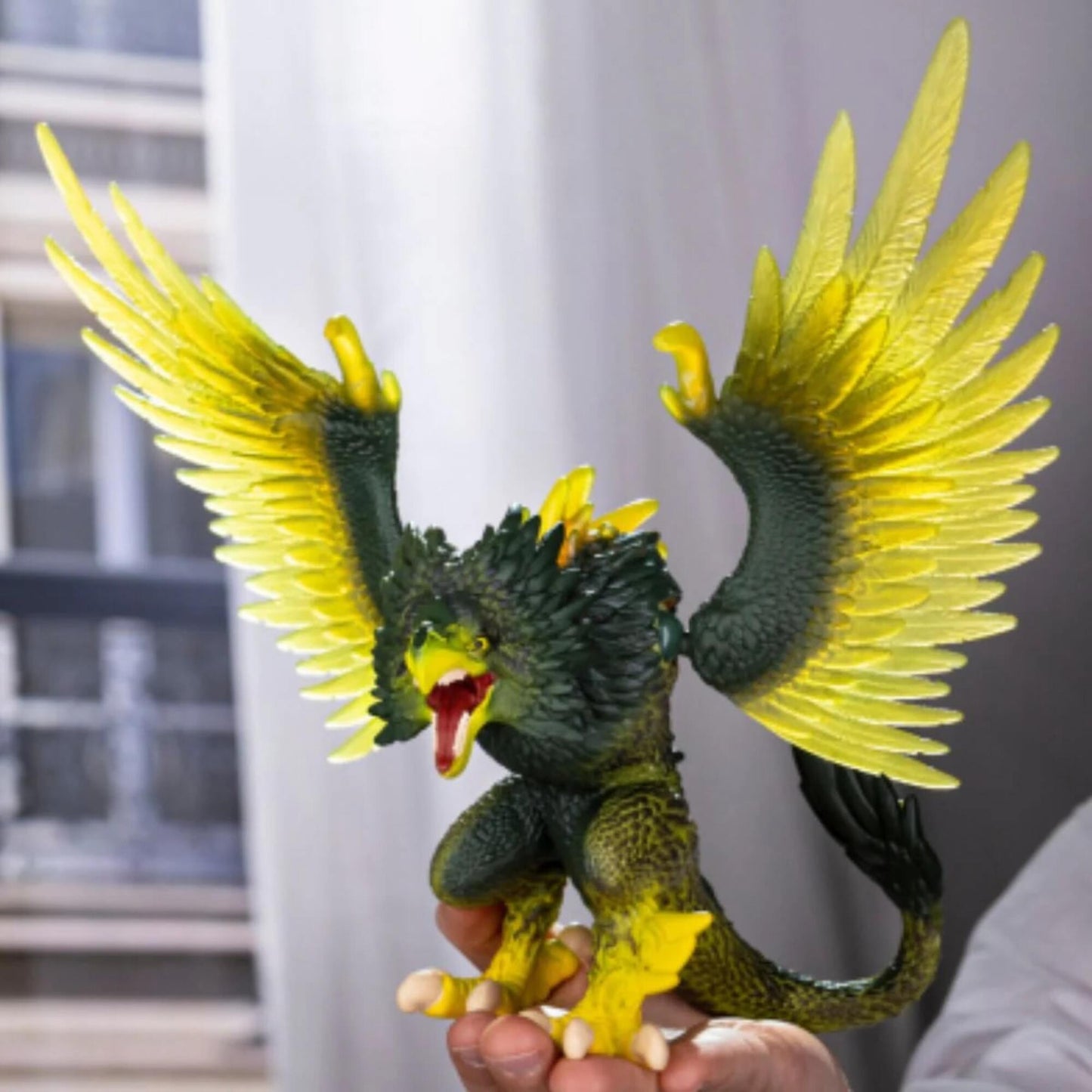 Eldrador Creatures Jungle Raptor toy with yellow wings and green body