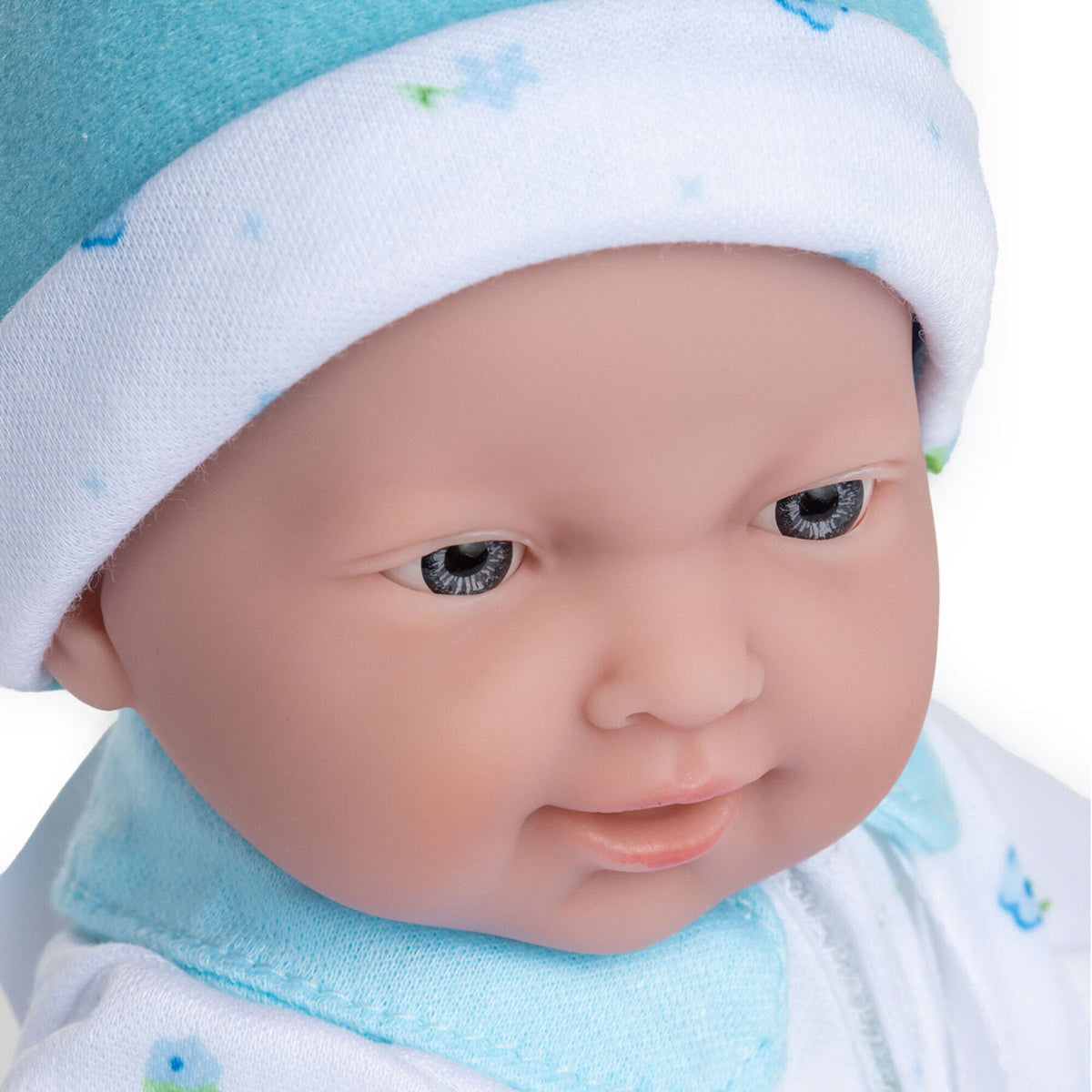 JC Toys La Baby Caucasian doll wearing blue outfit and white hat with pacifier
