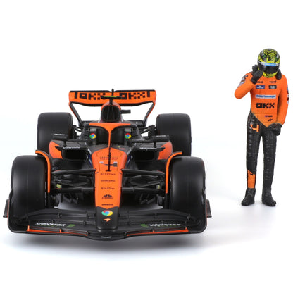 Bburago McLaren MCL38 1:24 scale die-cast race car in orange with black accents, displayed with Lando Norris figure i...
