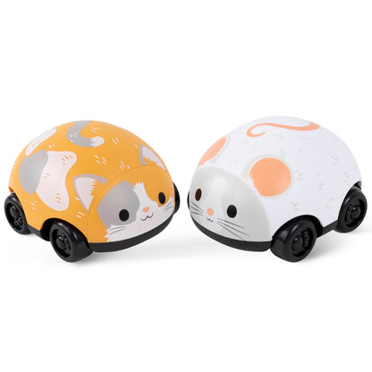 Two cat-themed pull-back toy cars: one orange and white, one white and peach, each with black wheels and cute cat faces