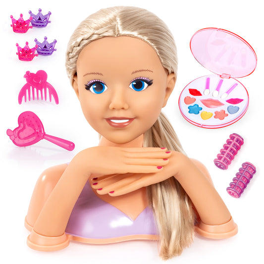Styling head doll with blonde hair and blue eyes, shown with pink and purple crown accessories, hair comb, heart-shaped mirror compact with colorful makeup appl