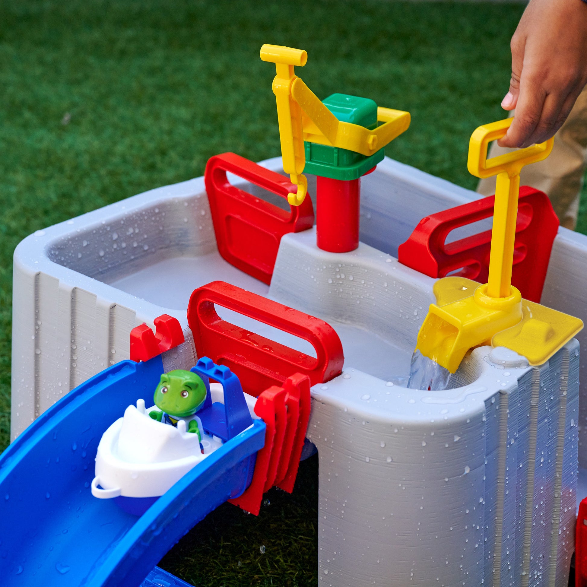 AquaPlay Harbor water toy set with colorful pumps, shovels, and green character figure
