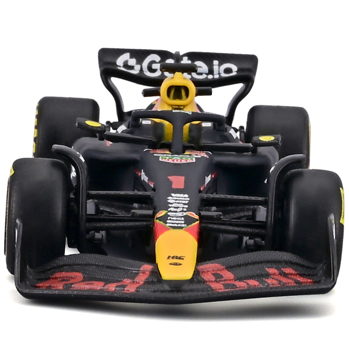 Bburago Red Bull RB21 1:43 scale die-cast race car with yellow and black livery, displayed front-view with pit pass p...