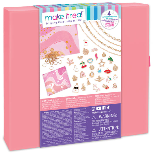 Make It Real charm jewelry kit in pink box with four chain necklaces, 32 metal charms including stars, hearts, and themed pendants, jump rings, and instruction