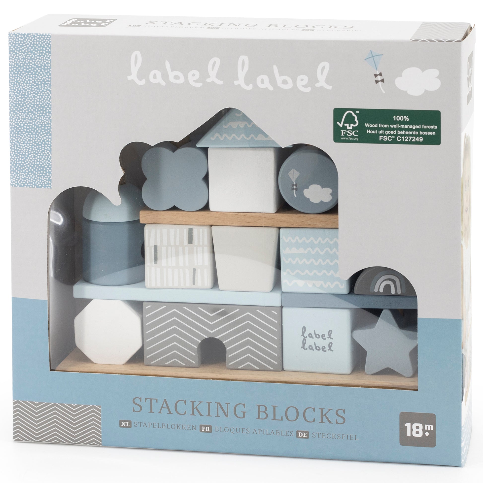 Label Label stacking blocks set with cloud, mountain, star, and geometric patterned wooden blocks in blue, gray, and white on display shelf