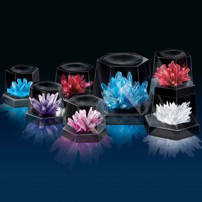 4M Crystal Growing Kit with 7 colorful crystals in blue, purple, pink, red and white displayed in black hexagonal cases
