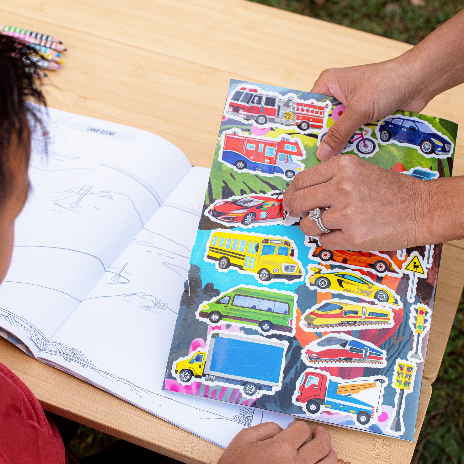 Fold-Out Coloring Book Vehicles with colorful sticker sheets and blank pages