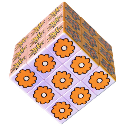 JOS Art Cube Flower Pop toy with orange flowers and decorative patterned sides