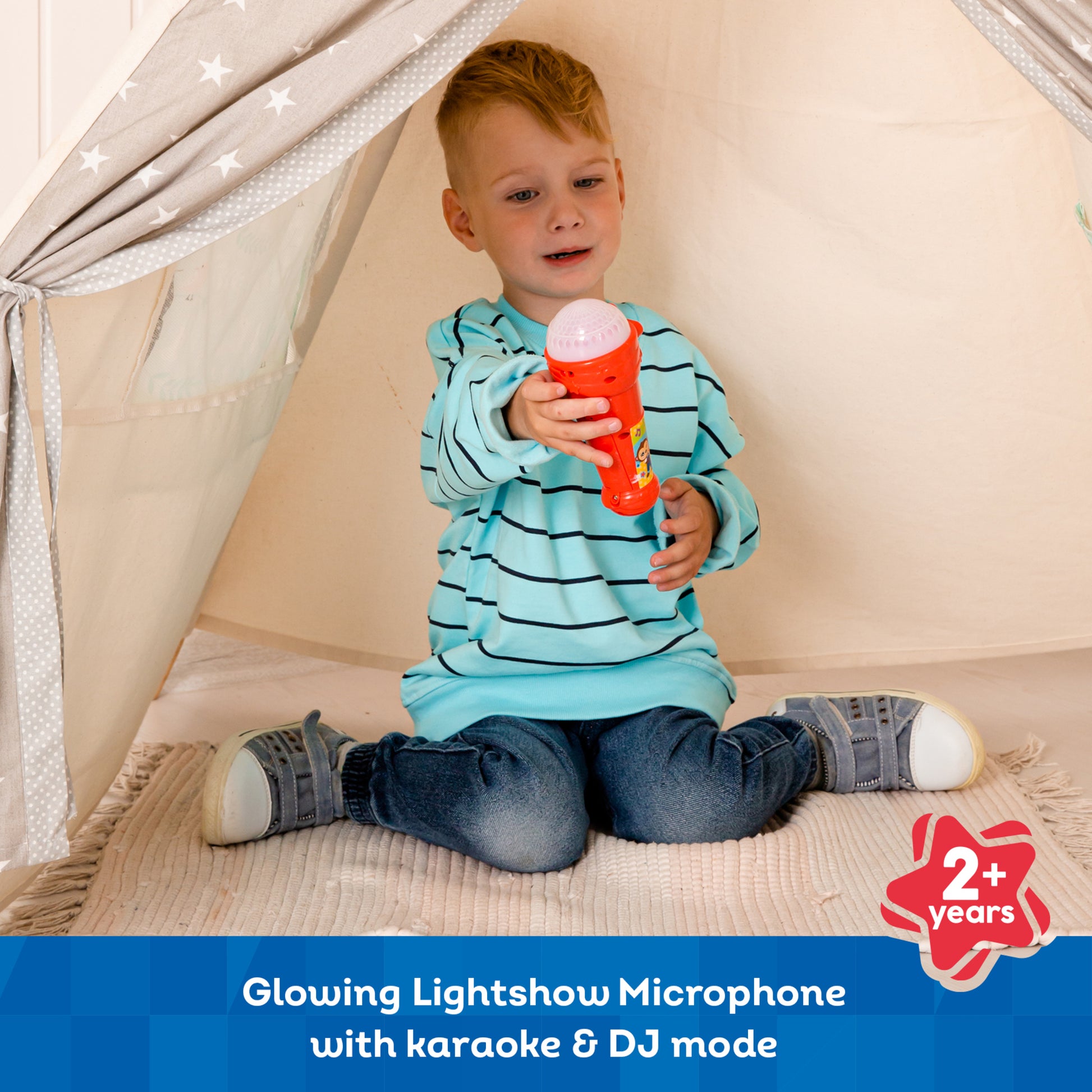 Red Light Show Microphone with karaoke mode, glowing lights, held by toddler in blue striped shirt