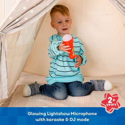Red Light Show Microphone with karaoke mode, glowing lights, held by toddler in blue striped shirt