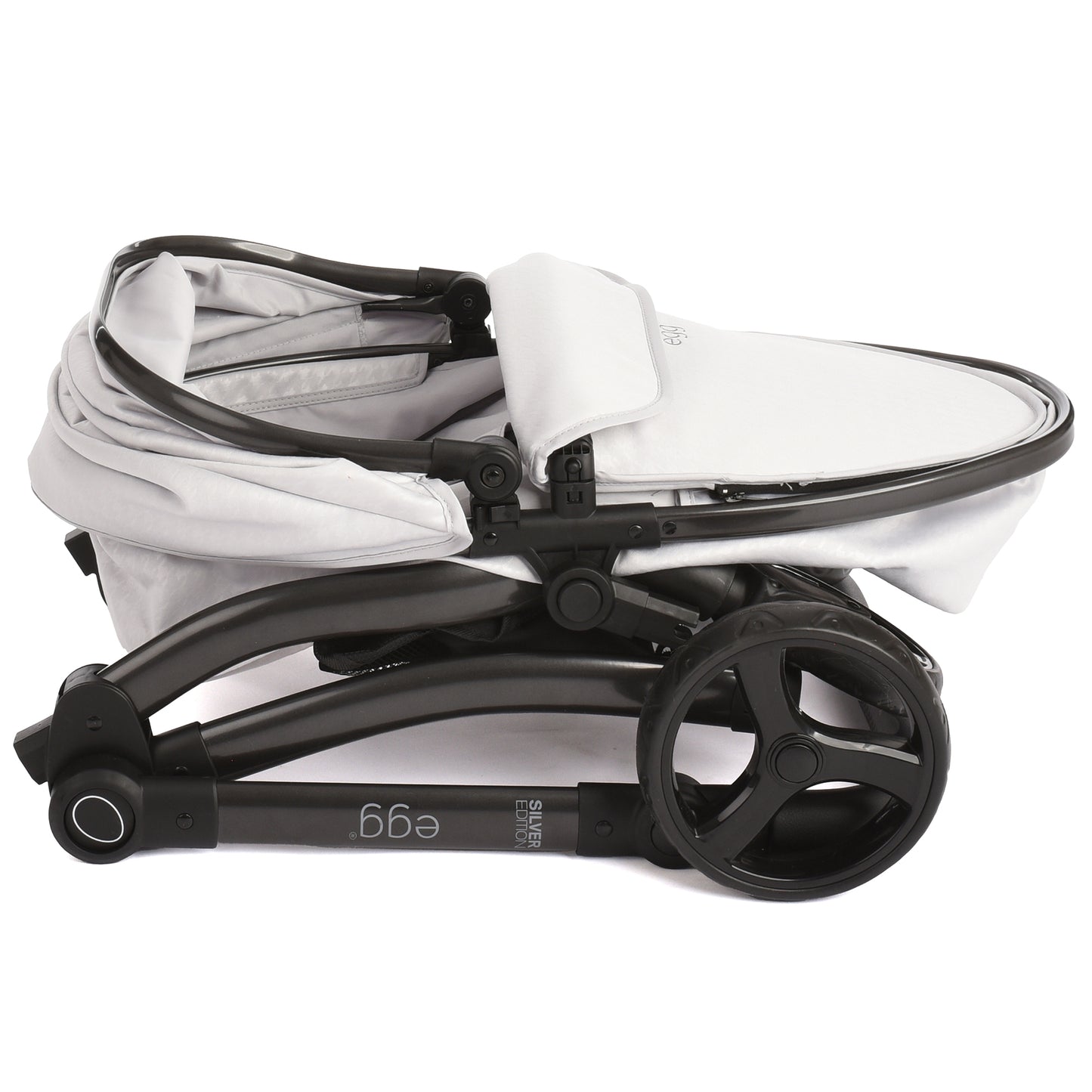 Roma Egg Doll Pram in white and black, compact stroller with canopy