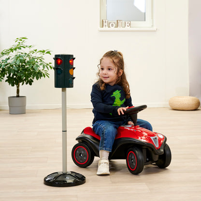 BIG Traffic Stoplight toy with red and yellow lights, child on red ride-on car