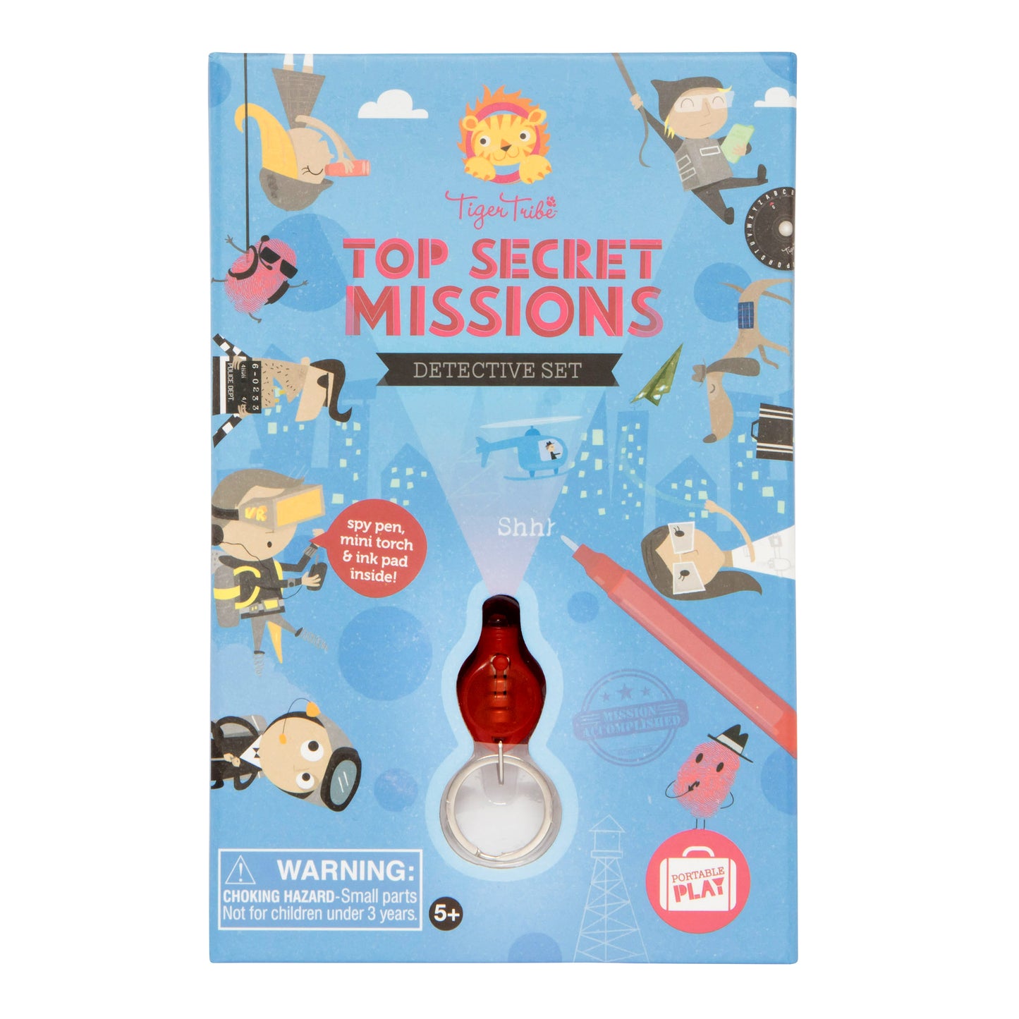 Tiger Tribe Top Secret Missions Detective Set box featuring spy-themed illustrations, lion logo, and red magnifying glass torch attachment on blue background
