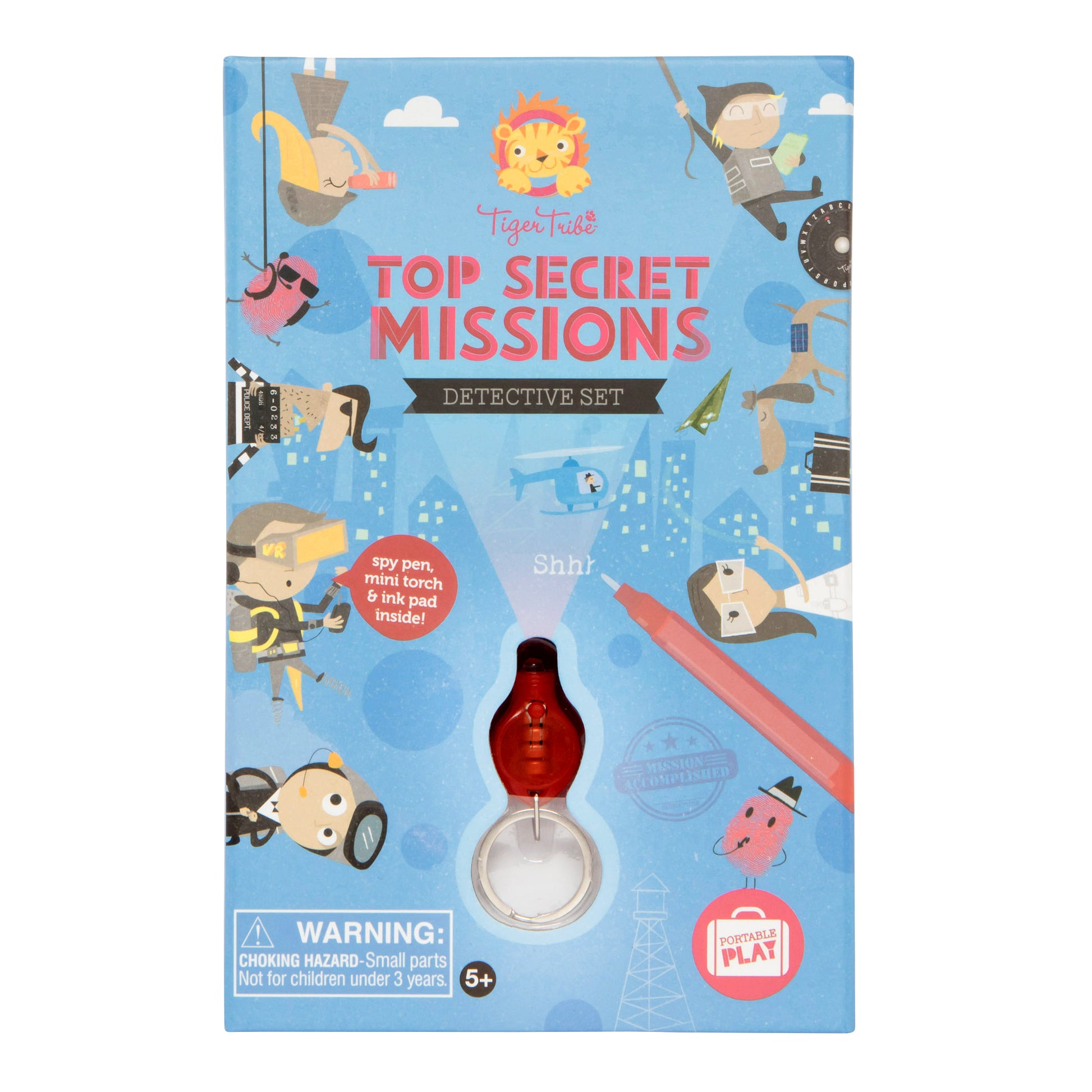 Tiger Tribe Top Secret Missions Detective Set box featuring spy-themed illustrations, lion logo, and red magnifying glass torch attachment on blue background