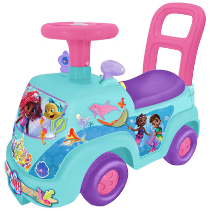 Turquoise ride-on toy with pink steering wheel and backrest, purple seat and wheels, decorated with mermaid and sea character graphics