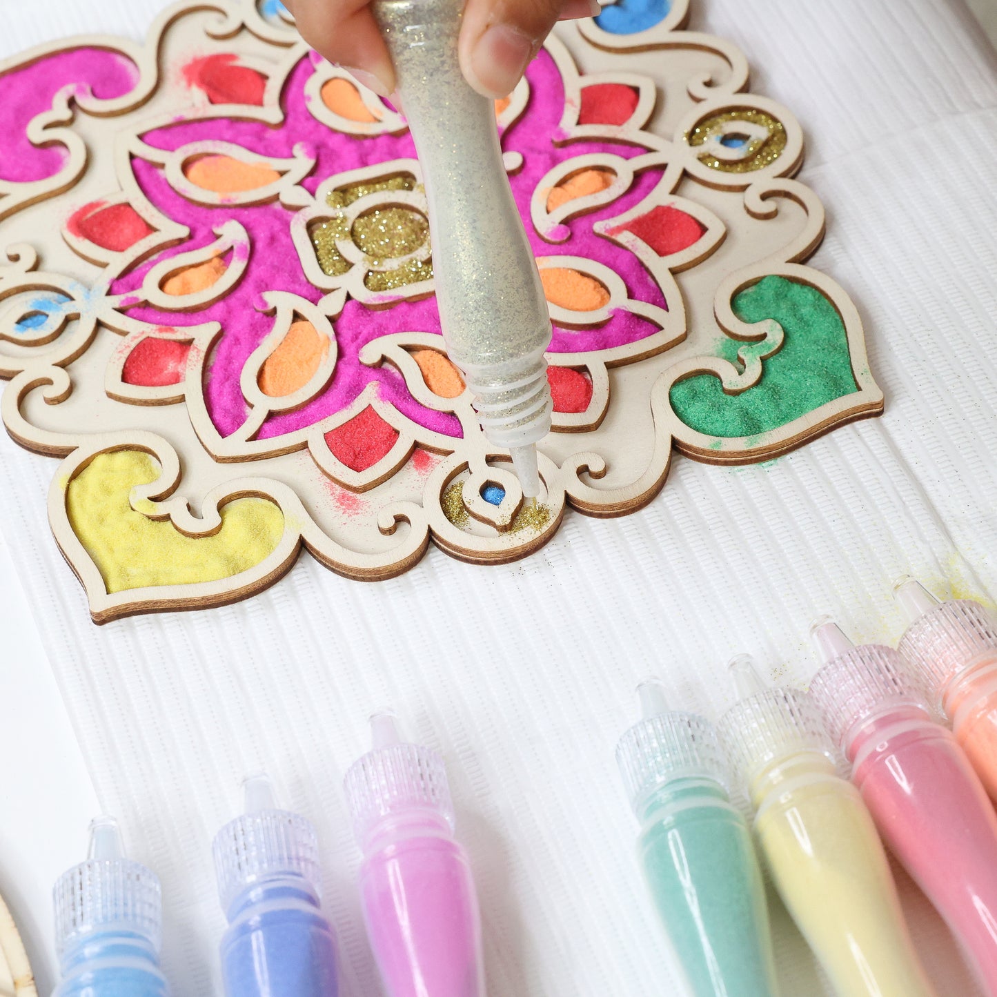 Make Your Own Wooden Rangoli kit with colorful markers and decorated wooden pieces
