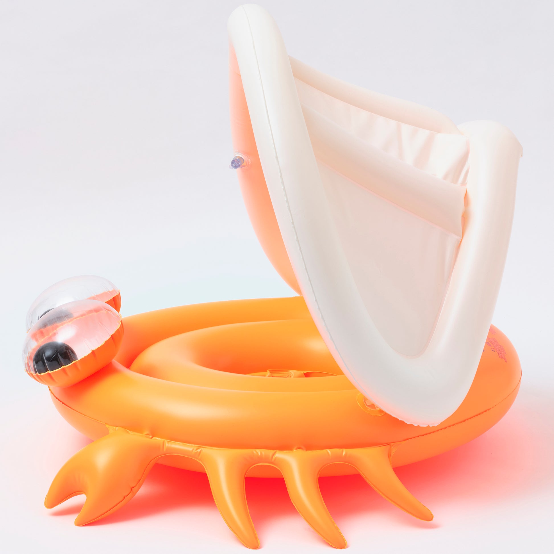 Baby Float Sonny the Sea Creature in neon orange with white canopy and water squirt toy