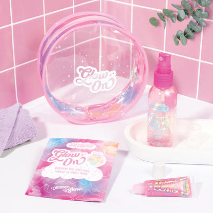 Glimmer & Glow beauty bag set with pink mist, sheet mask, lip gloss and clear case