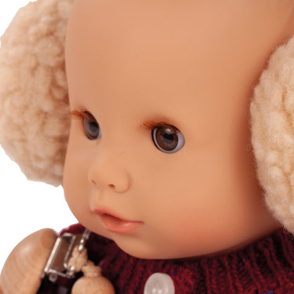 Jubilee Sleepy Aquini 13 inch doll with brown eyes, cream bonnet, and burgundy outfit