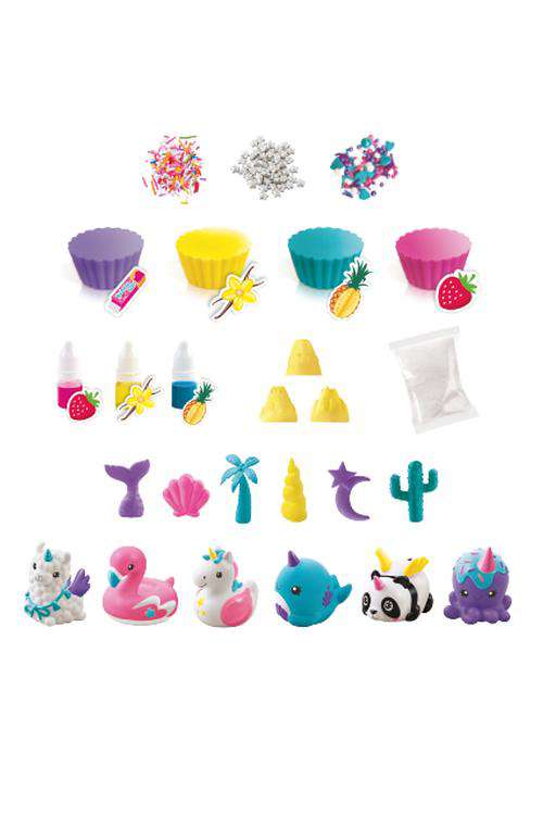 So Soap DIY Soap Factory kit contents including colorful cupcake molds, soap colorants, decorative beads, rubber charms, bath bomb molds, and finished soap duck
