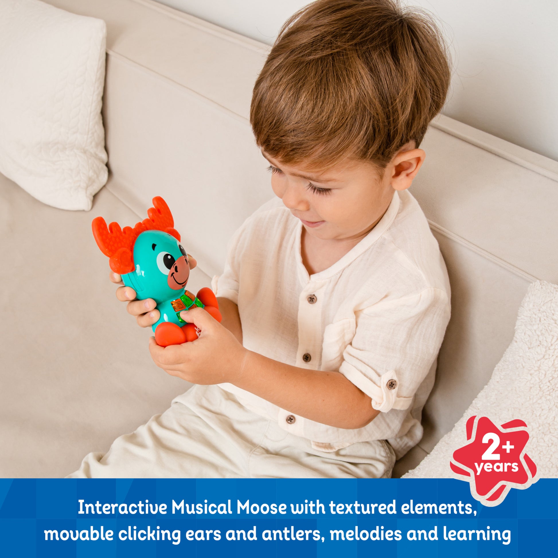 Babykins Moose toy with turquoise body and orange antlers, interactive musical toy for toddlers 2+
