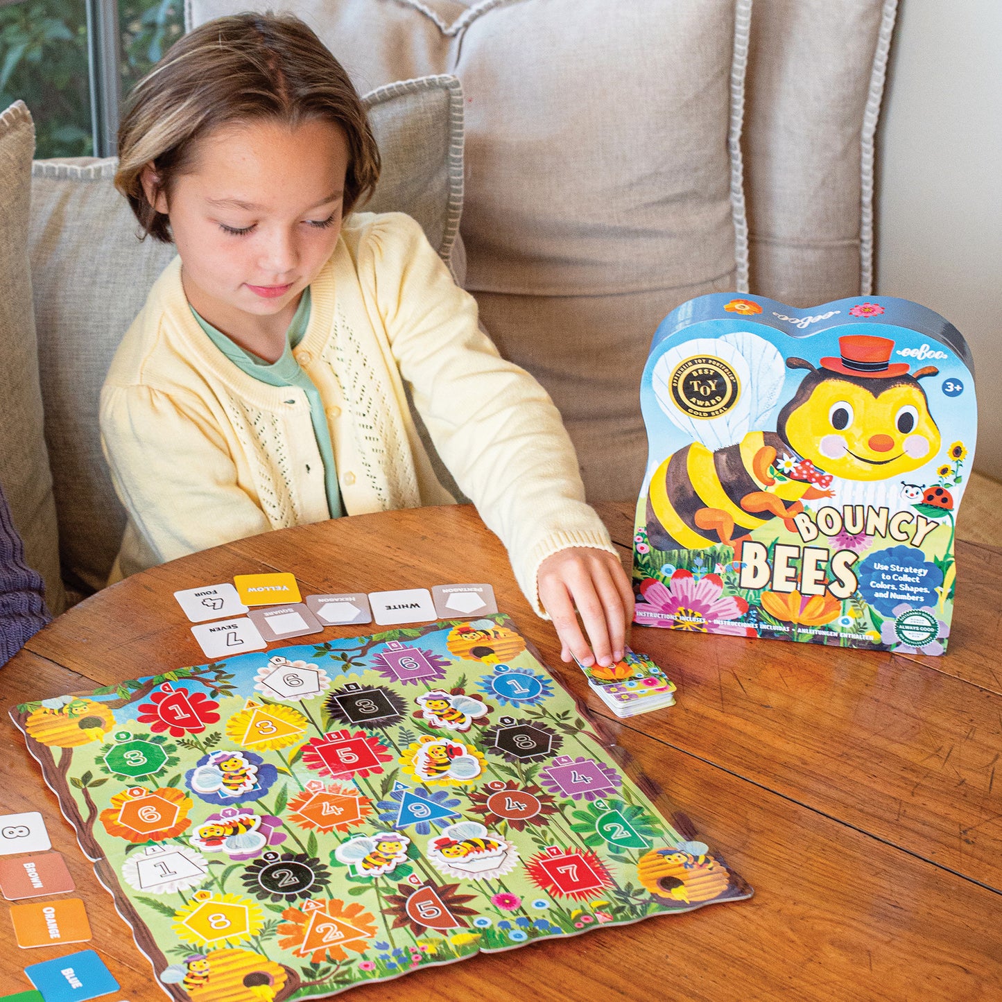 Bouncy Bees educational game with colorful flower board and bee pieces for children