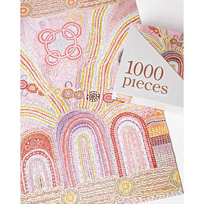 JOS Journey Home 1000 Piece Puzzle with pink, red, and yellow Aboriginal dot painting design