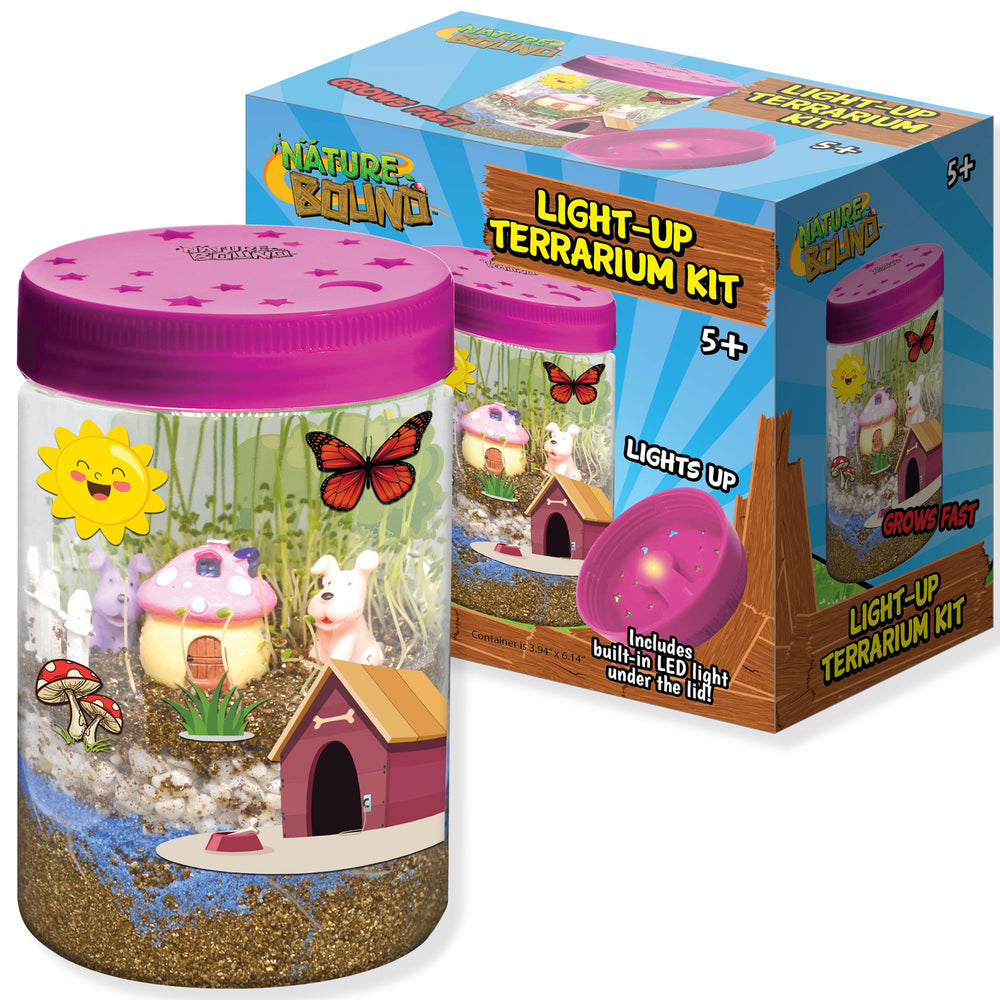 Nature Bound Light-Up Terrarium Kit with pink lid, cylindrical container filled with sand and miniature scene including mushroom house, small animal figures, bu