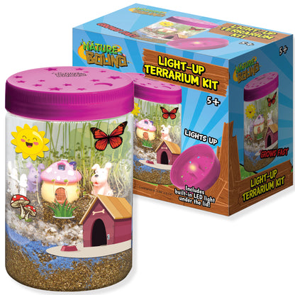 Nature Bound Light-Up Terrarium Kit with pink lid, cylindrical container filled with sand and miniature scene including mushroom house, small animal figures, bu
