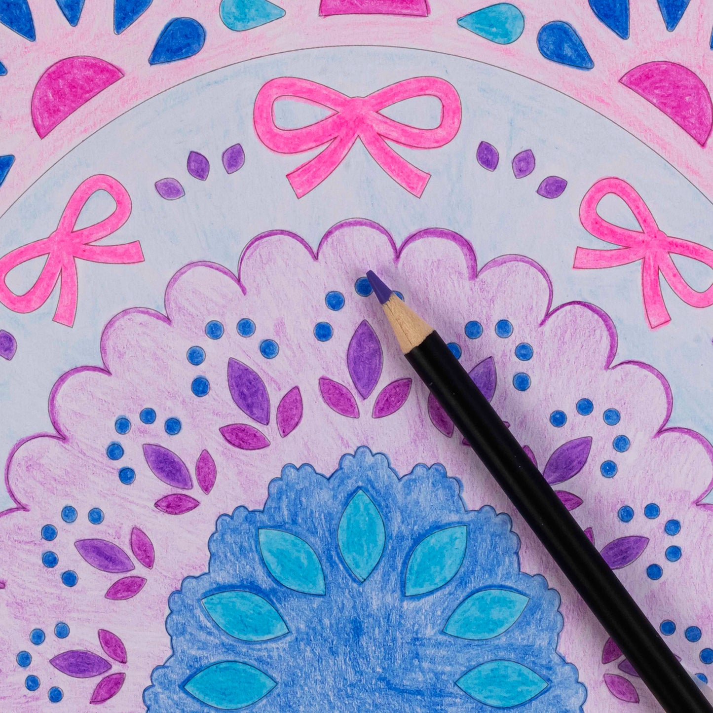 Mixed Media Coloring Pad with rainbow-themed sheets featuring pink bows, blue flowers, and purple details with colore...