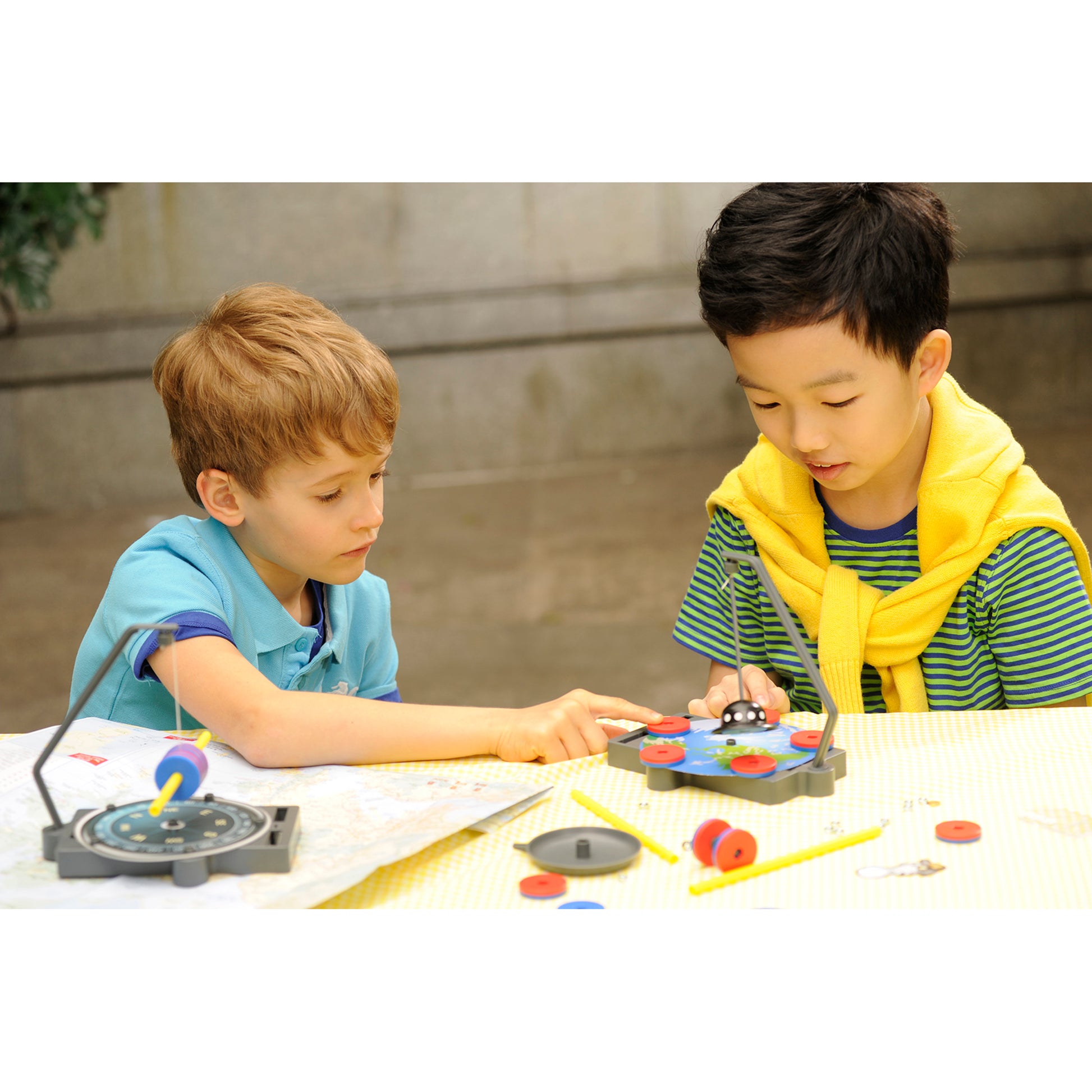 KidzLabs Anti-Gravity Maglev magnetic toy with two children playing