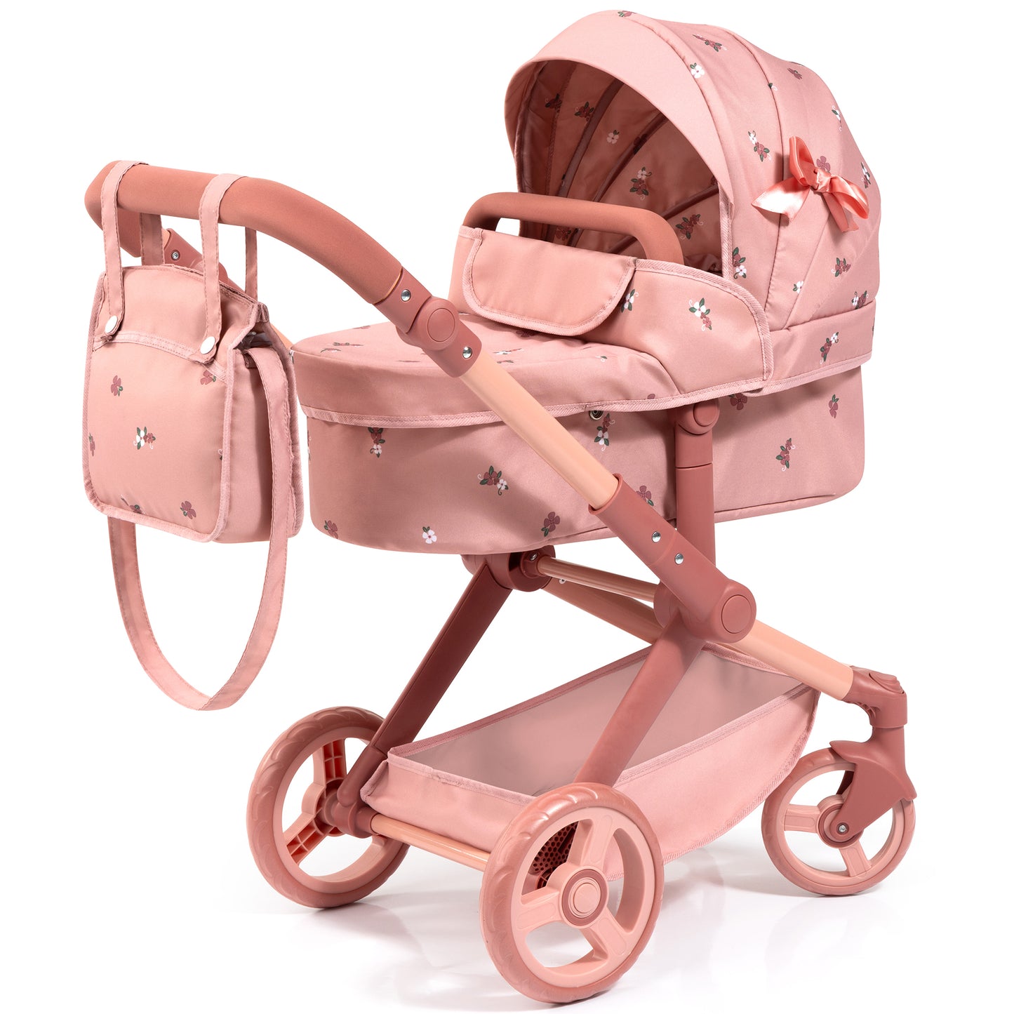 Coral pink doll pram with floral pattern, includes carriage with hood, lower basket, and matching shoulder bag